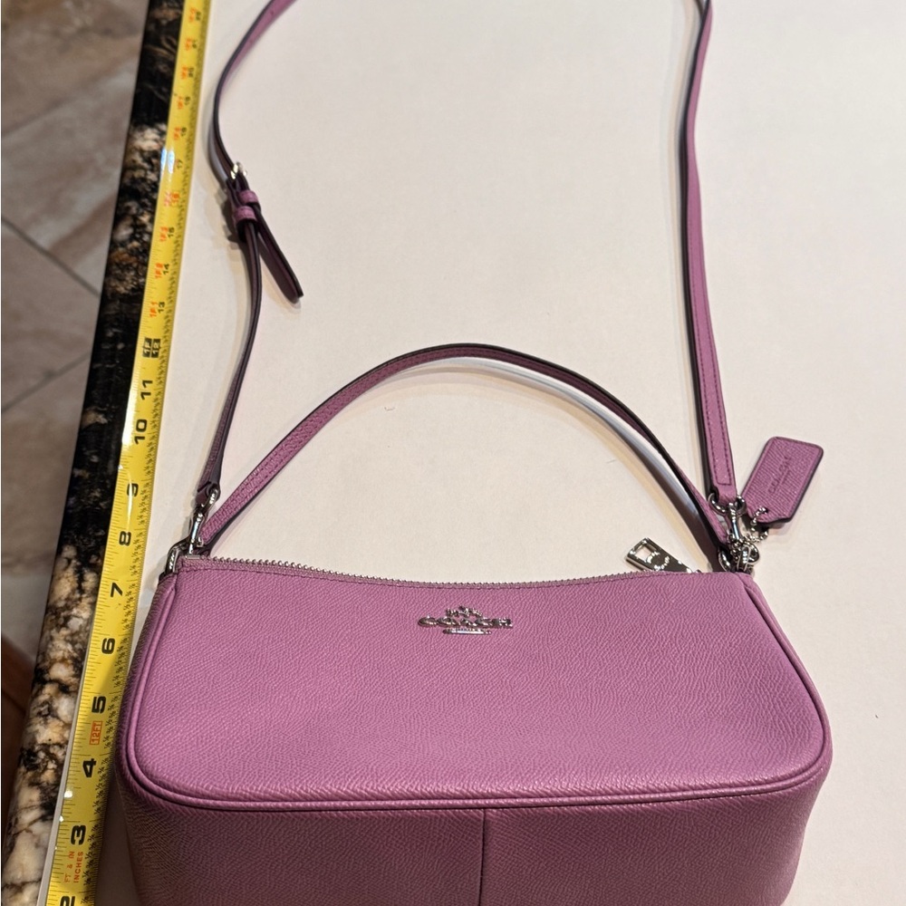 Coach Pink Crossbody Bag with Adjustable Strap and Silver Hardware